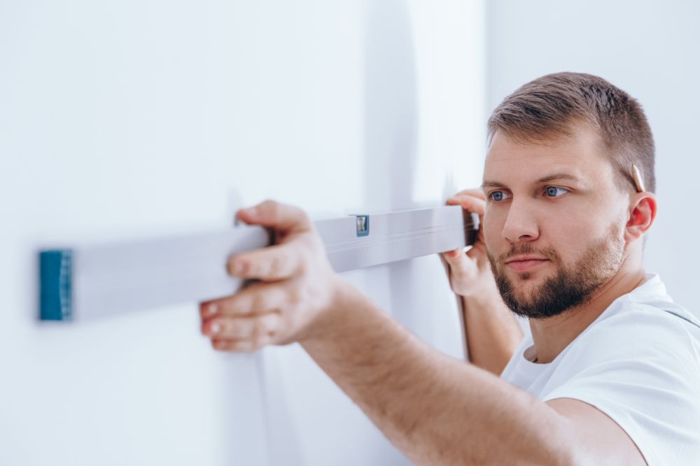 Is A Pre-purchase Home Inspection Worth The Cost? Worker Checking The Wall PANFFWC 1